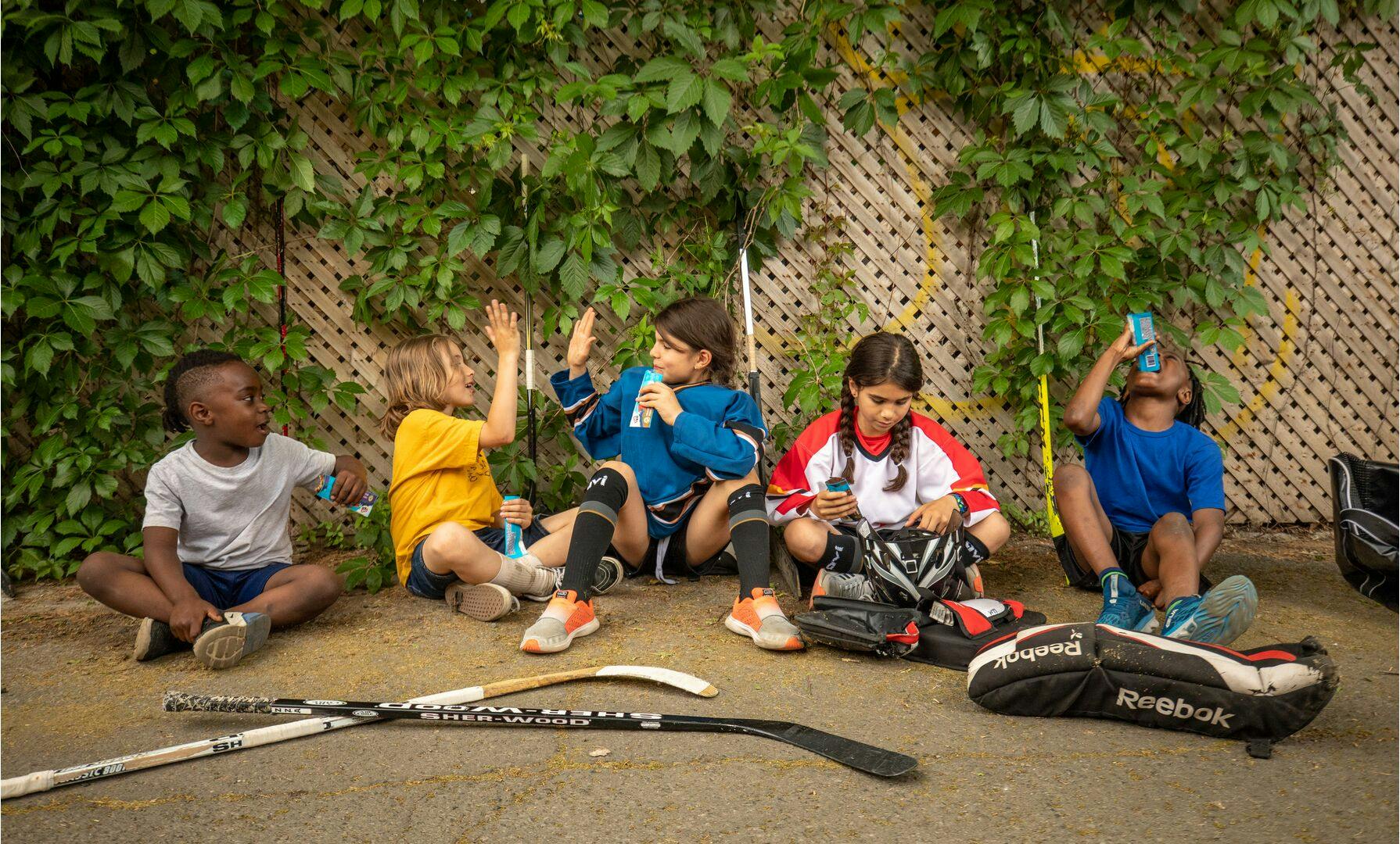 Kids Taking a Break From Hockey - Having a Snack