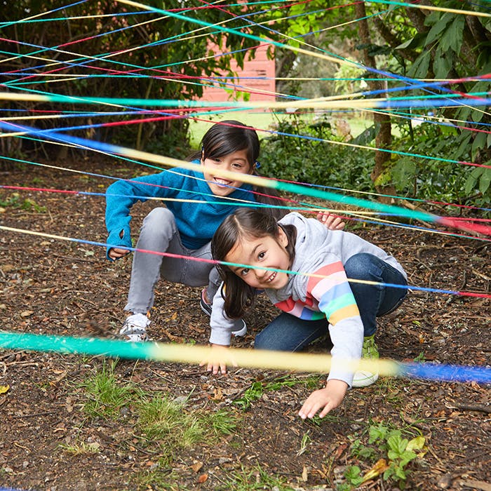 Girls playing in obstacle course