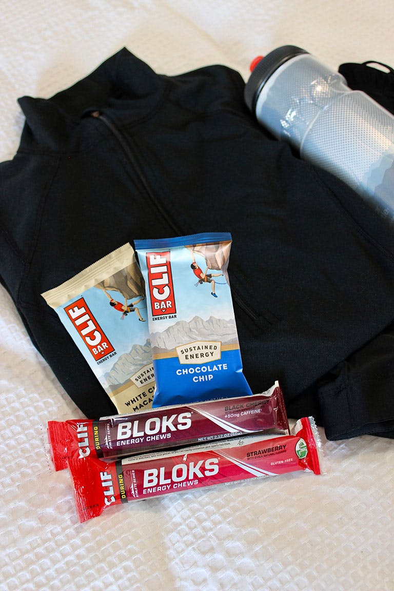CLIF BAR White Chocolate Macadamia Nut and Chocolate Chip with CLIF BLOKS Black Cherry and Strawberry cycling essentials