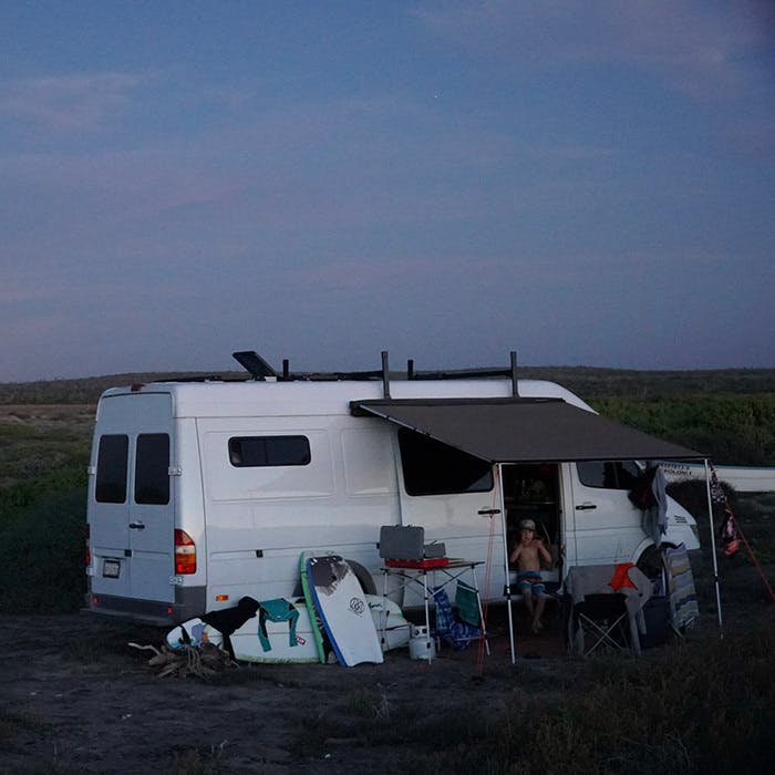 Sprinter van camping at sunset