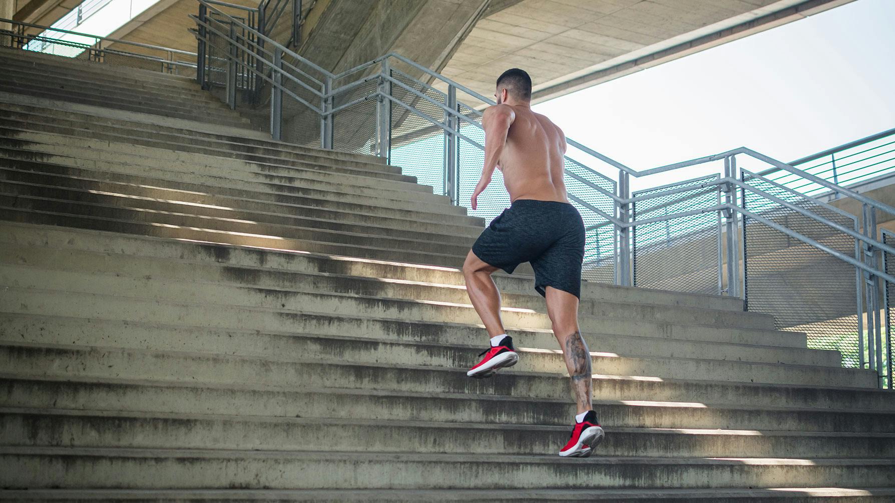 Athlete running up stairs