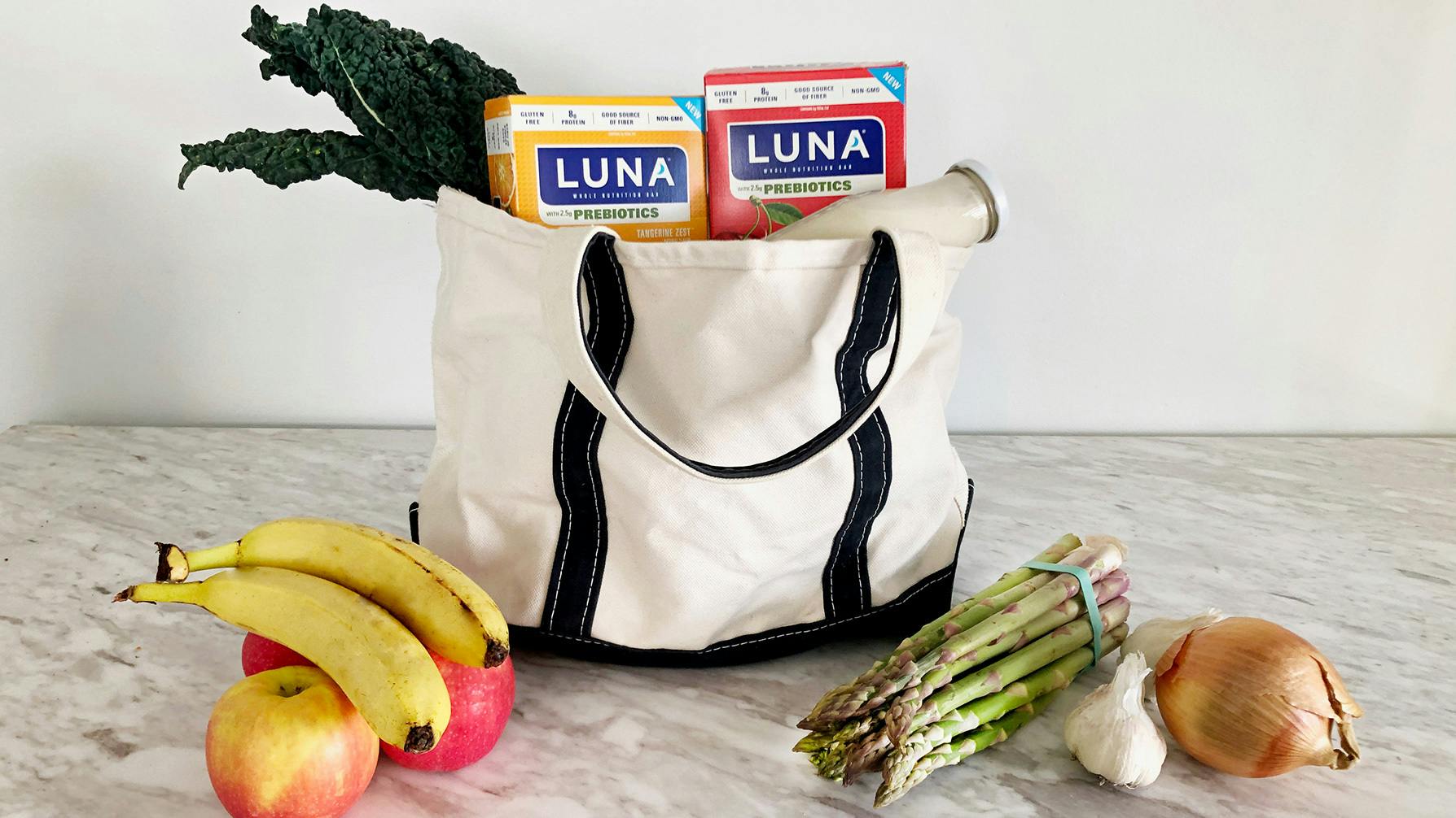 Grocery bag with LUNA Bars with prebiotics, vegetables, and fruit