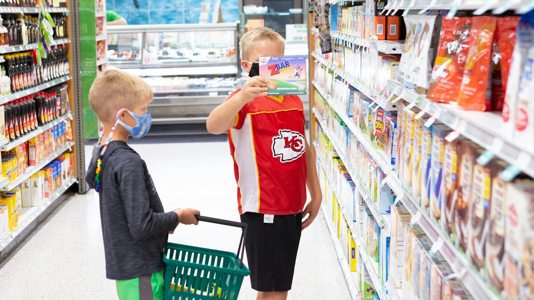 Kids picking out CLIF Kid Zbars at grocery store